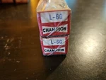 Nors Champion L-6G Spark Plugs (2). Fixed Price $14.00.