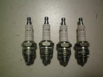 Champion Quantity Four Of #J6C/#823 Spark Plugs, Free Shipping. Fixed Price $16.95.