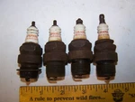 Lot Of 4 Vintage Early Rare Champion Com 1 Spark Plug Car Memorabilia. Fixed Price $50.00.